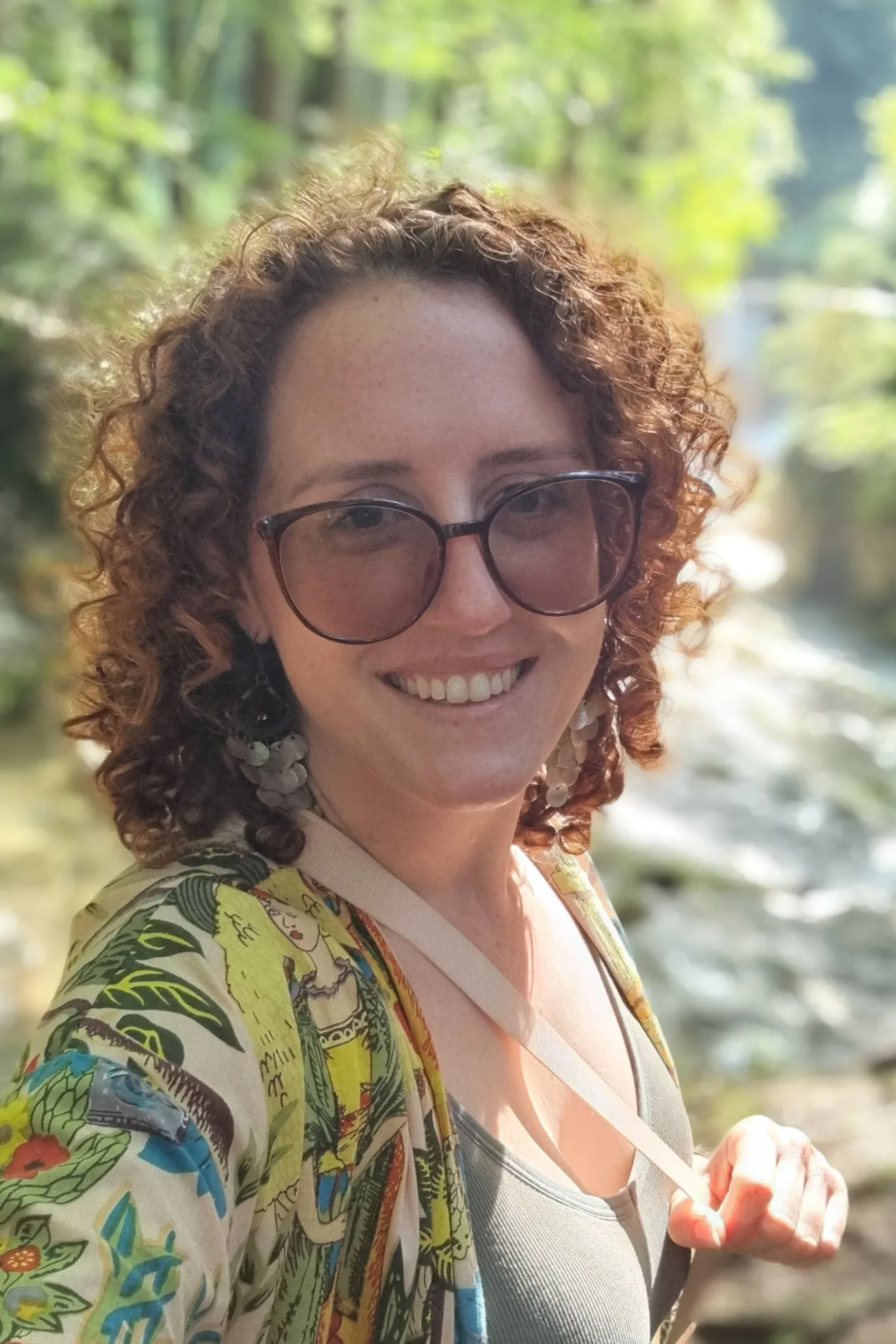 Roxy Henley smiling outdoors in a patterned jacket